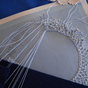 A piece of bobbin lace mid-creation for a Duke of Edinburgh Award course