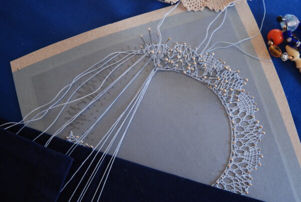 A piece of bobbin lace mid-creation for a Duke of Edinburgh Award course